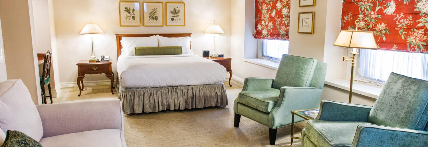 One of our ADA-equipped rooms at our boutique hotel in downtown Seattle featuring bed, chairs and sofa.