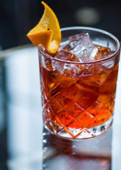 Drink in glass with orange peel