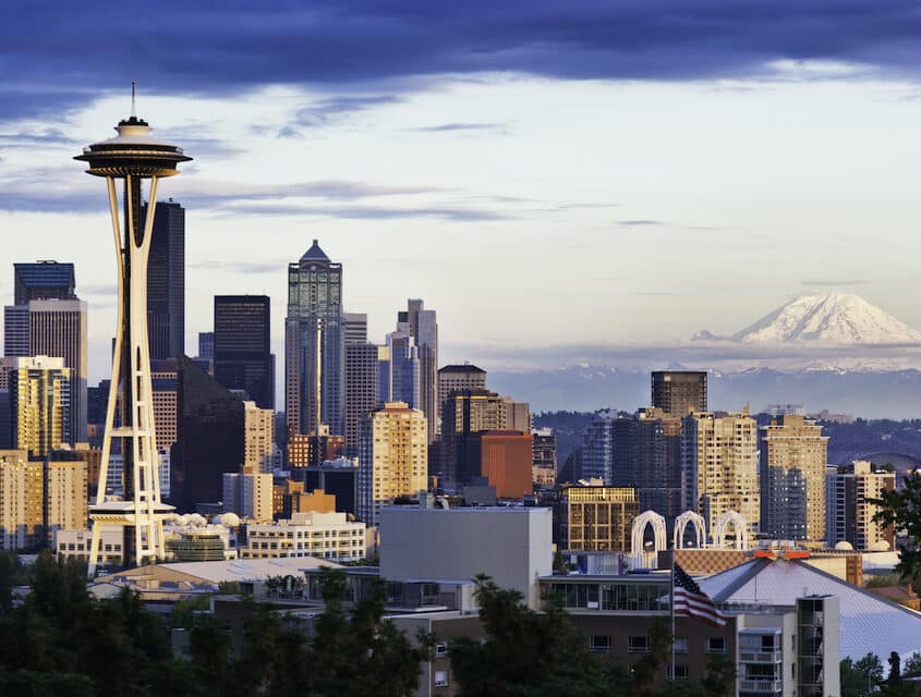 Seattle skyline shows Mount Rainier, the Space Needle, and other city buildings and hotels in Seattle downtown.