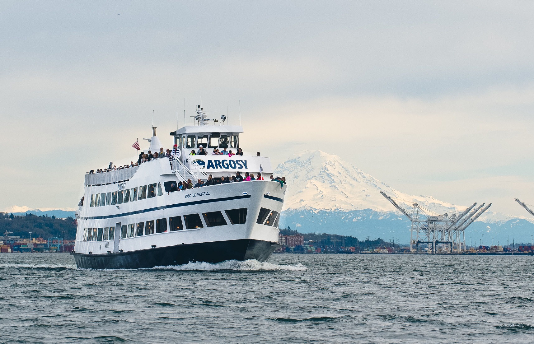 Photo of Mount Baker behind an Argosy vessel one of their many Seattle local cruises.