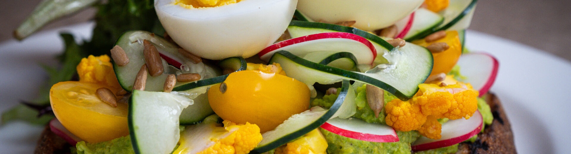 Hummus Breakfast Toast from Oliver's Sunday Brunch Menu.